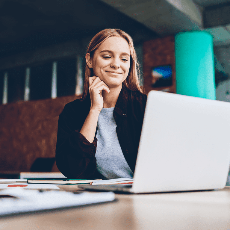 Woman smiling at laptop