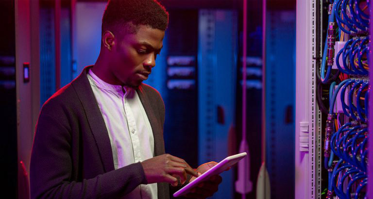 Man using tablet in datacenter