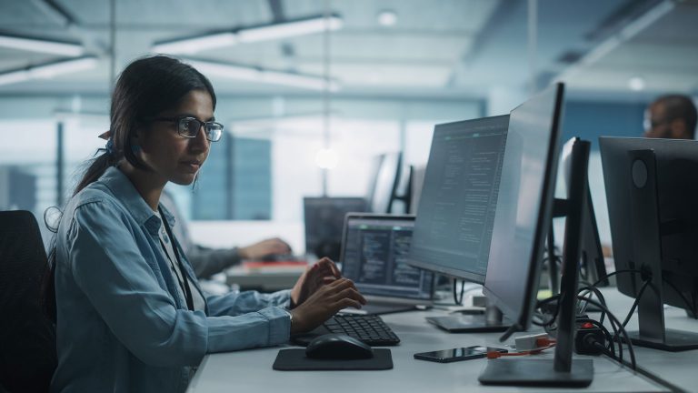 Woman coding on Laptop