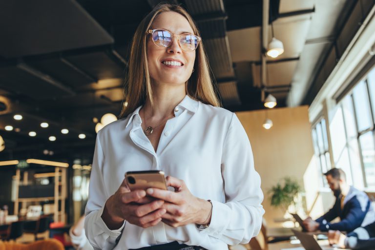 Woman smiling with smart phone