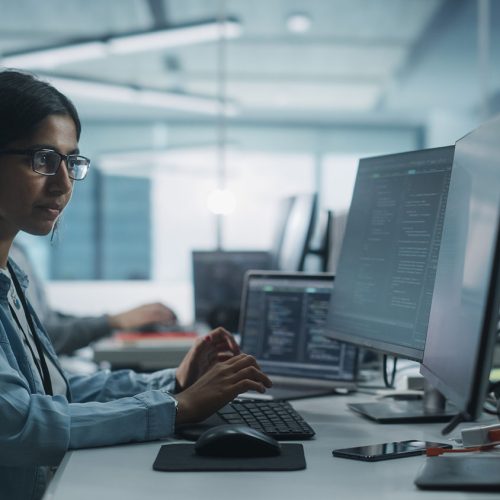 Woman coding on Laptop